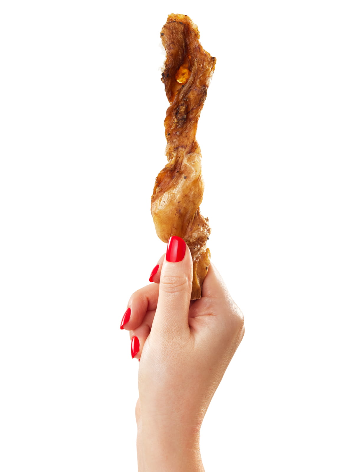 Hand with red nails holding single Floppy Ear air dried beef strip chew showing twisted natural texture