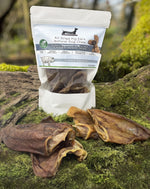 Floppy Ear Air Dried Pig Ears Natural Dog Chew 4 Medium Size pouch on moss