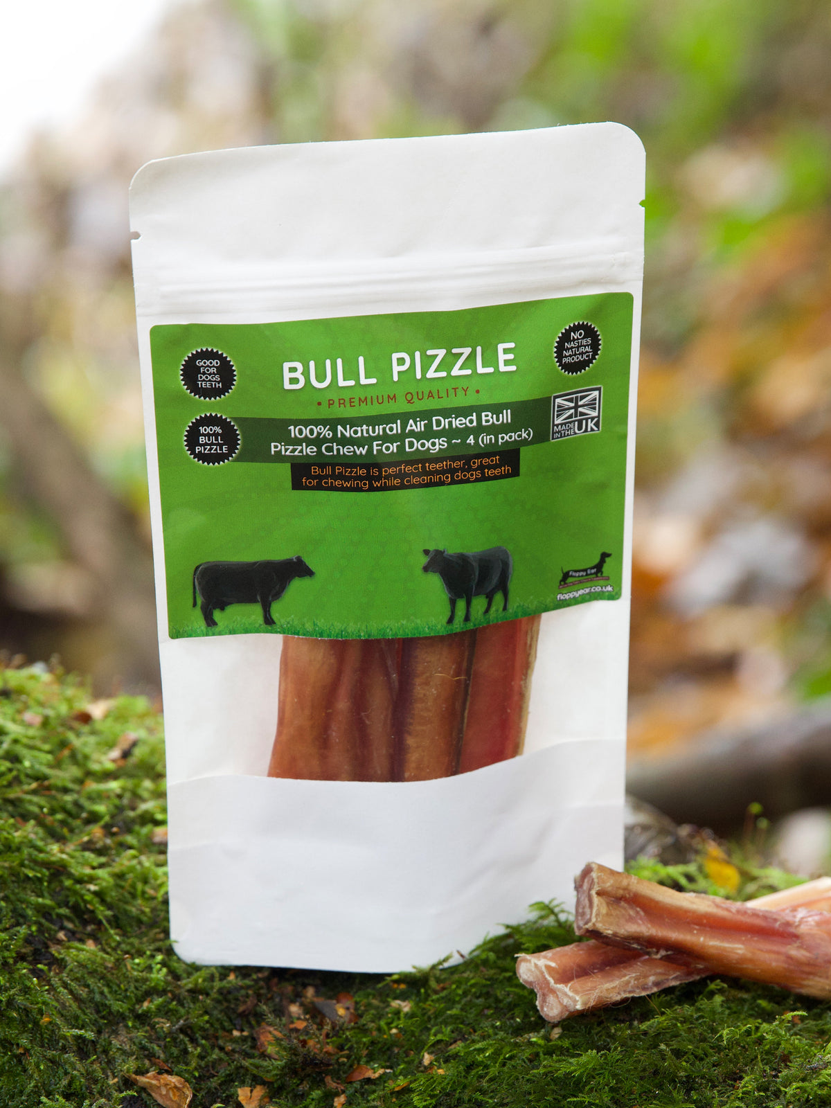Floppy Ear Bull Pizzle Premium Quality Air Dried Dog Chew pouch with loose pieces on moss