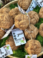 Floppy Ear Coco Ball 100% Natural Dog Chews displayed in bamboo bowl on wood with moss