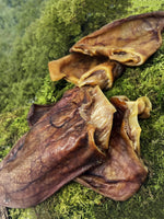 Natural air-dried pig ears for dogs from Floppy Ear – 100% pure dried pig ear chews on moss, high protein grain-free dental treat