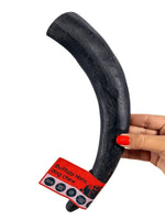 Hand holding a large natural buffalo horn dog chew from Floppy Ear – long-lasting, suitable for strong chewers, low fat dental chew