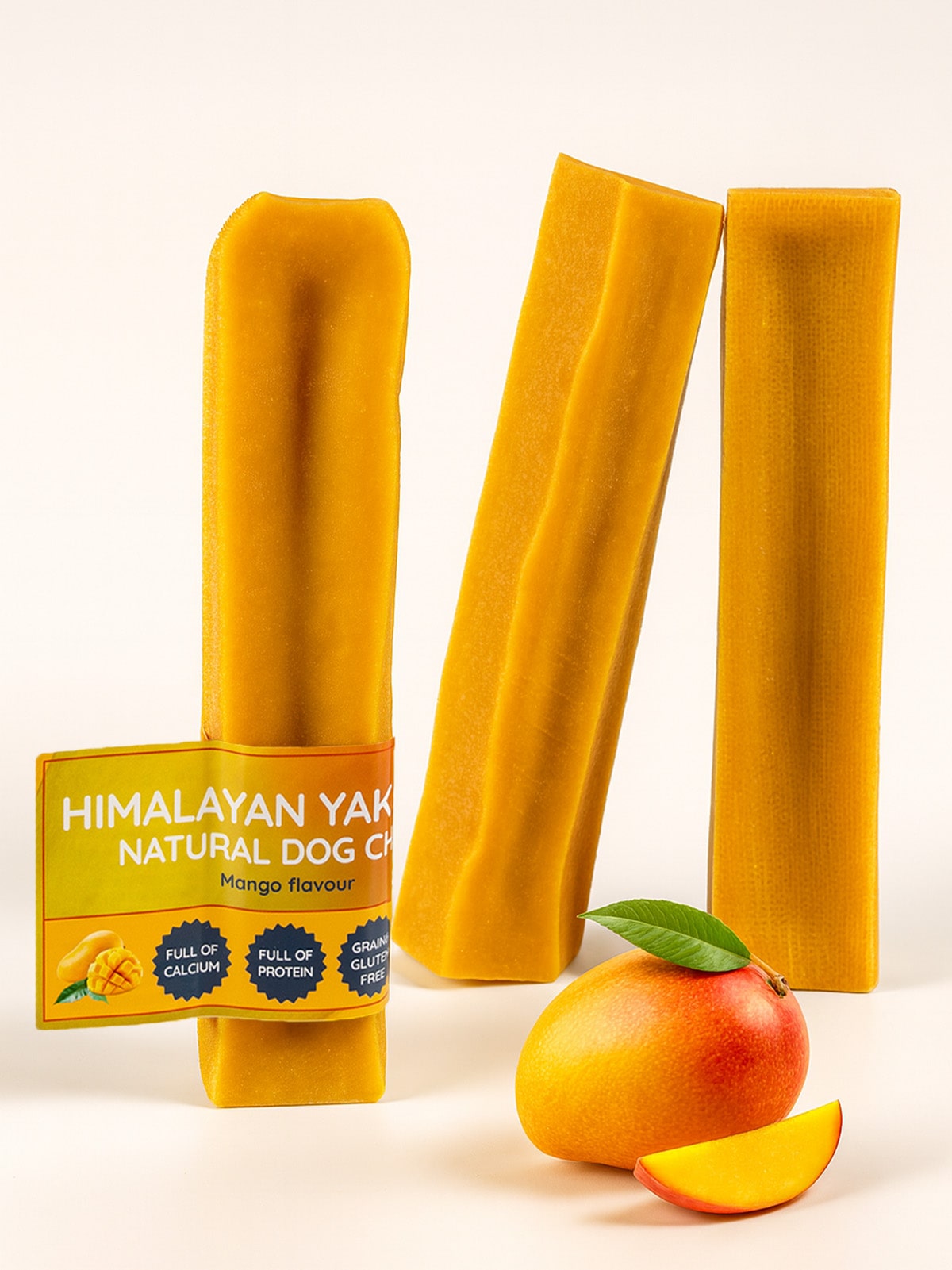 Floppy Ear Himalayan Yak Chews Mango Flavour three chews with fresh mango