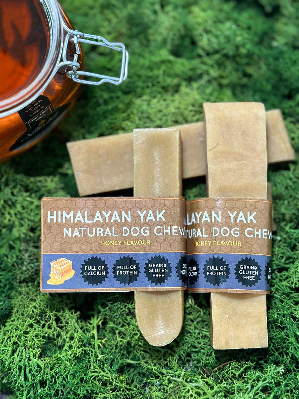 Floppy Ear Himalayan Yak Chews Honey Flavour Medium and Large sizes on moss with honey jar
