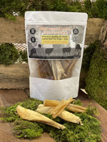 Floppy Ear 100% Natural Lamb Skin Dog Chew 300g pouch with loose strips on moss