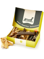 Floppy Ear Natural Chews & Treats Box open at an angle showing variety of premium natural dog chews and treats inside with "Pure. Healthy. Delicious." on the lid