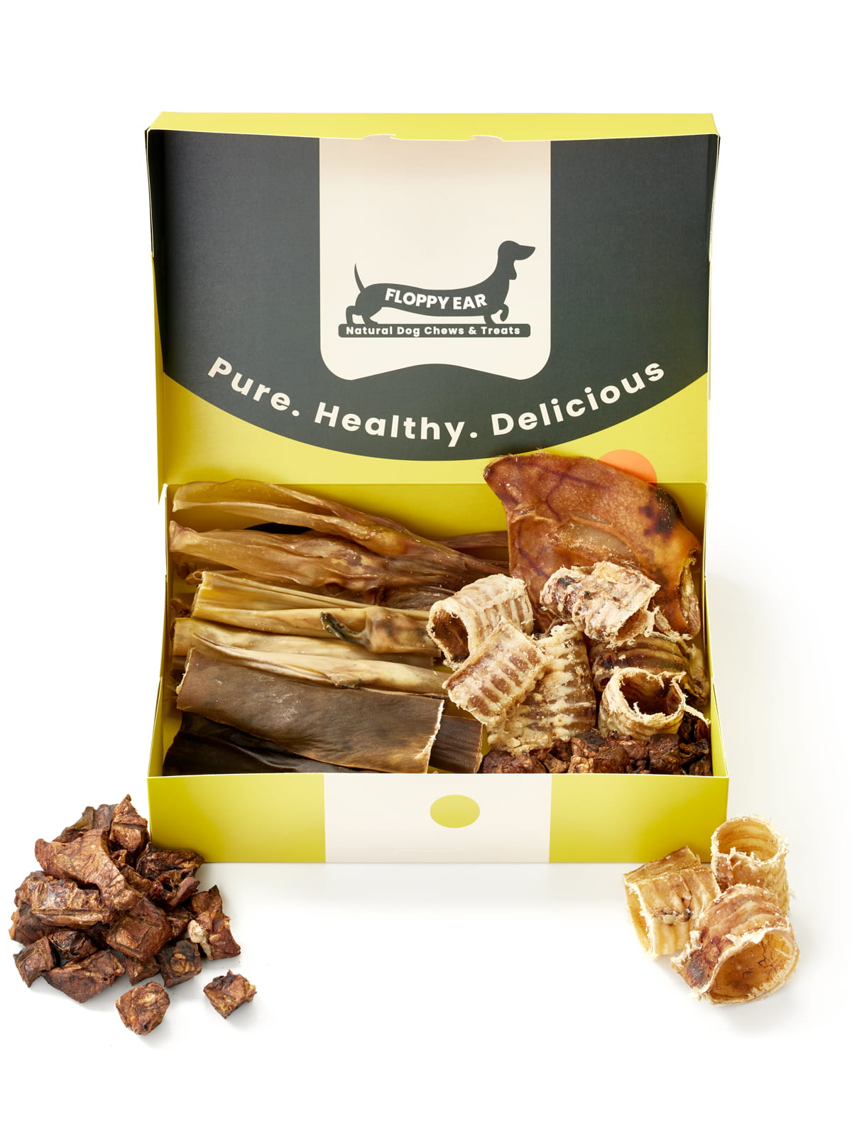 Floppy Ear Natural Chews & Treats Box open front view filled with variety of premium natural dog chews including beef cubes, trachea pieces and pig ear