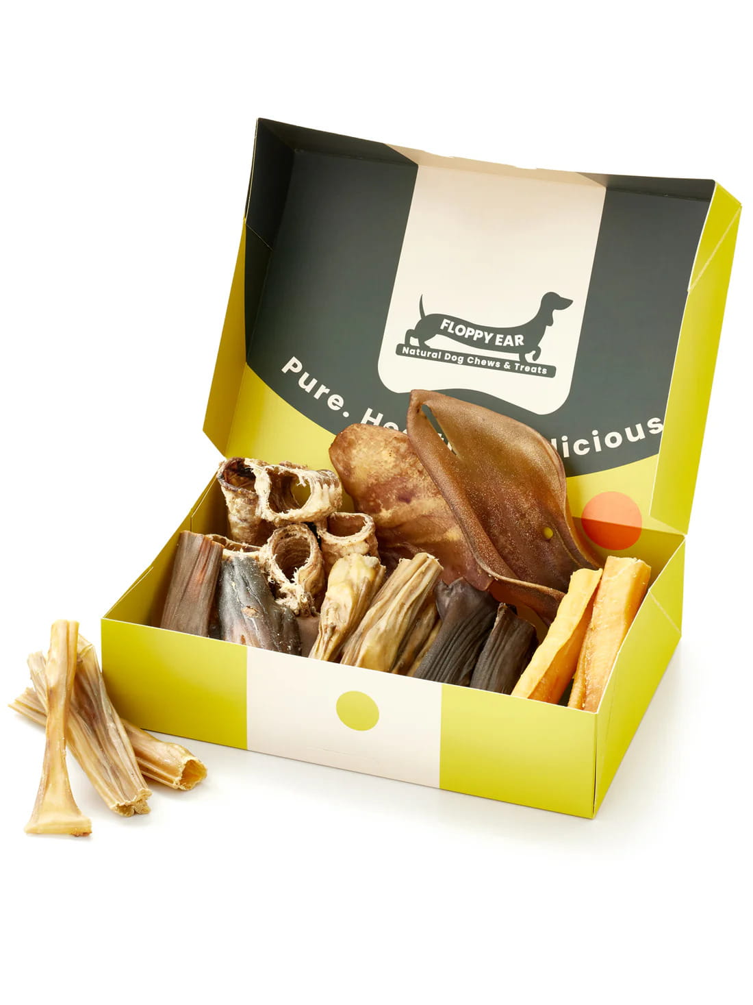 Floppy Ear Natural Chews Box open at an angle showing variety of premium natural dog chews and treats with "Pure. Healthy. Delicious." on the lid