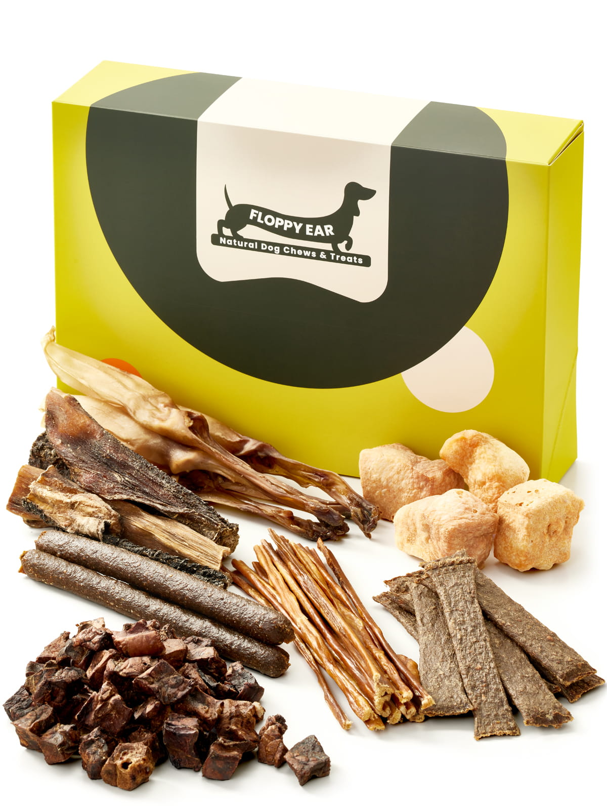 Floppy Ear Natural Treats Box closed with large selection of natural dog treats arranged in the foreground