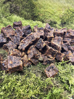 Floppy Ear 100% Natural Wild Meat Cubes Air Dried premium dog treats close up on moss