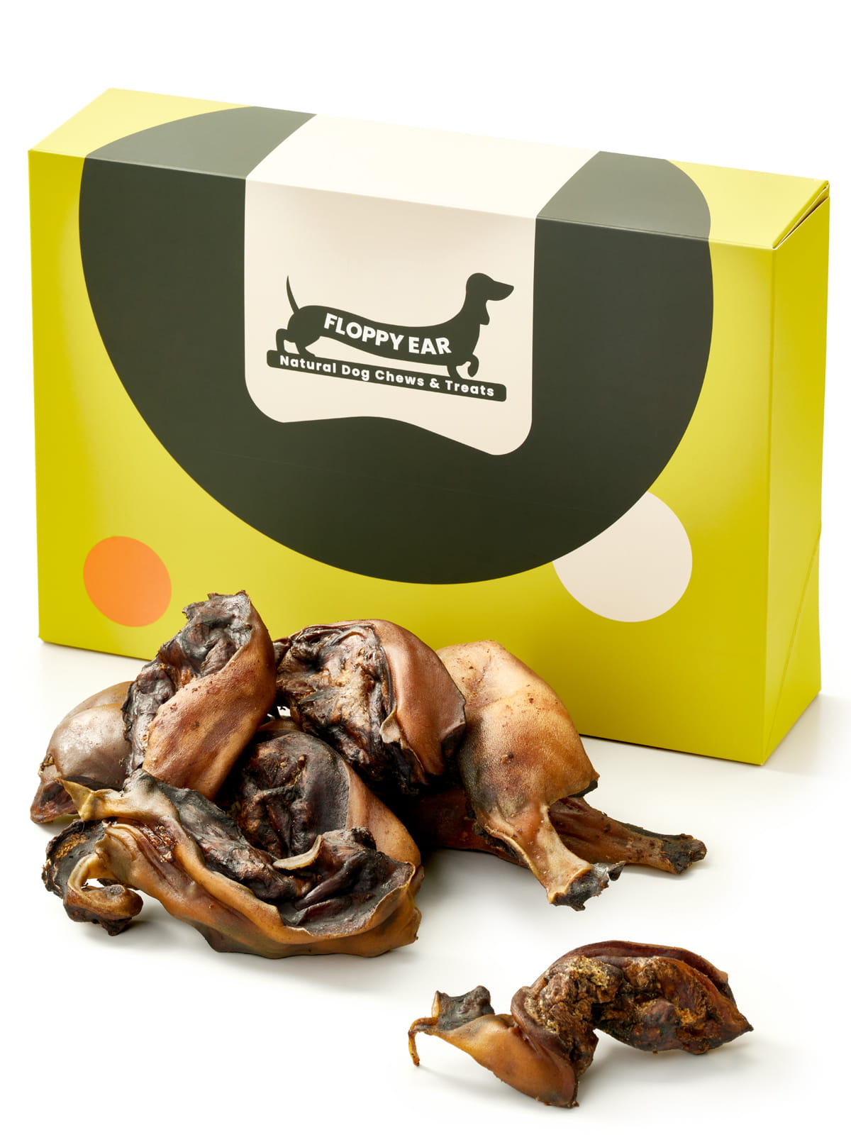 Floppy Ear Beef Collagen Strips Box closed with large pile of natural dried beef collagen chews in the foreground