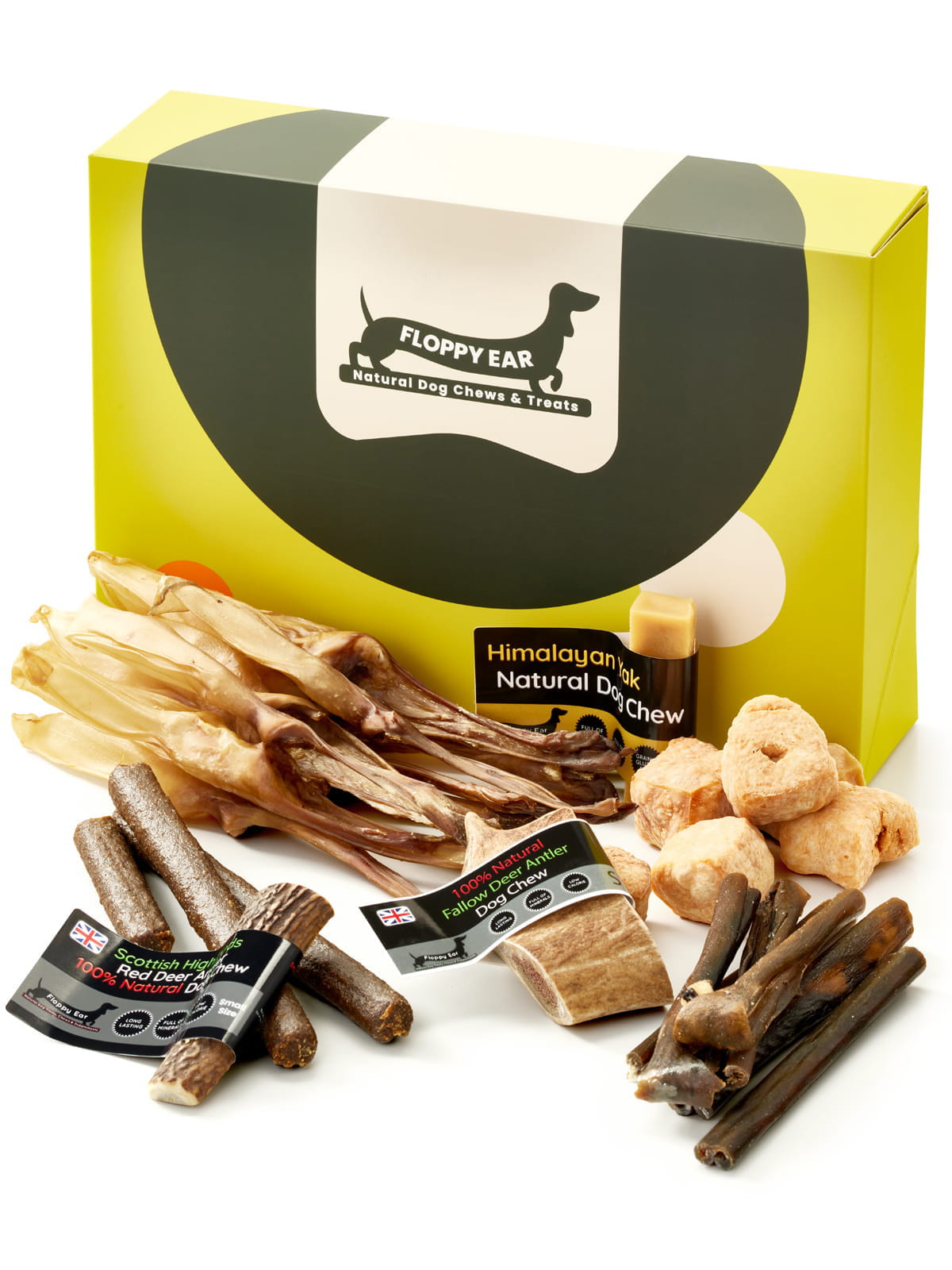 Floppy Ear Small Puppy Box closed with selection of natural dog chews and treats arranged in the foreground